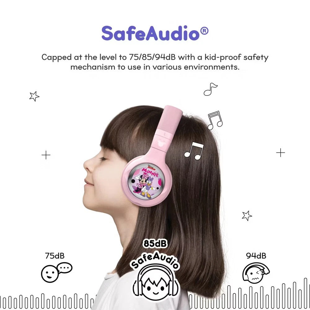 Child smiling while wearing wireless Disney StoryPhones headphones and playing an audio story  